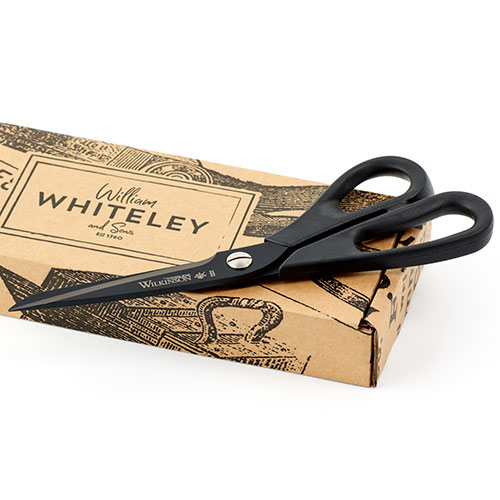 Wilkinson 10in Glide Lightweight Dressmaking and Upholstery scissors in full view with Whiteley's packaging.