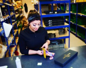 Jade packing an EXO gold in the warehouse