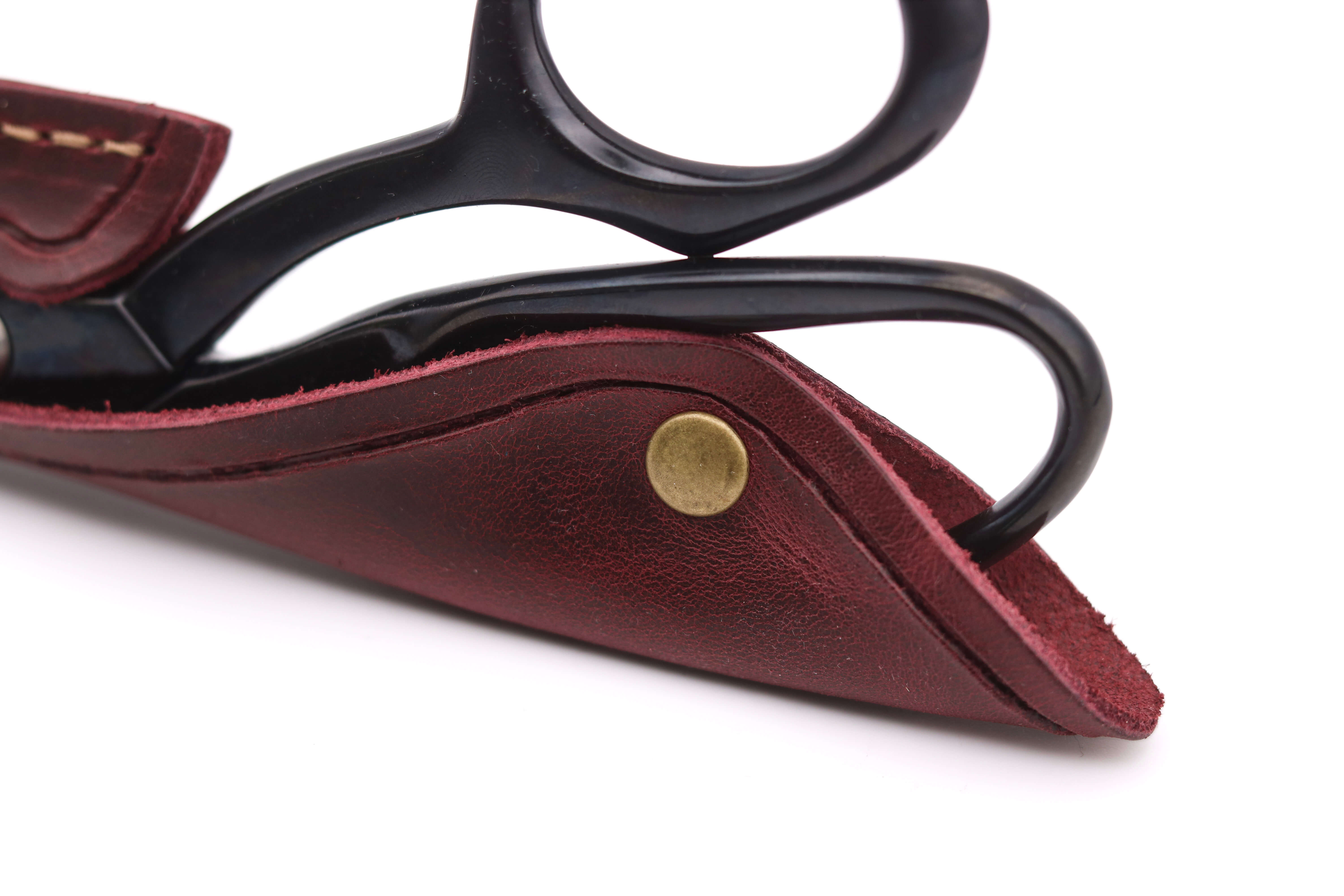 Oxblood leather sheath protecting a pair of Whiteley or Wilkinson 8-inch fabric shears