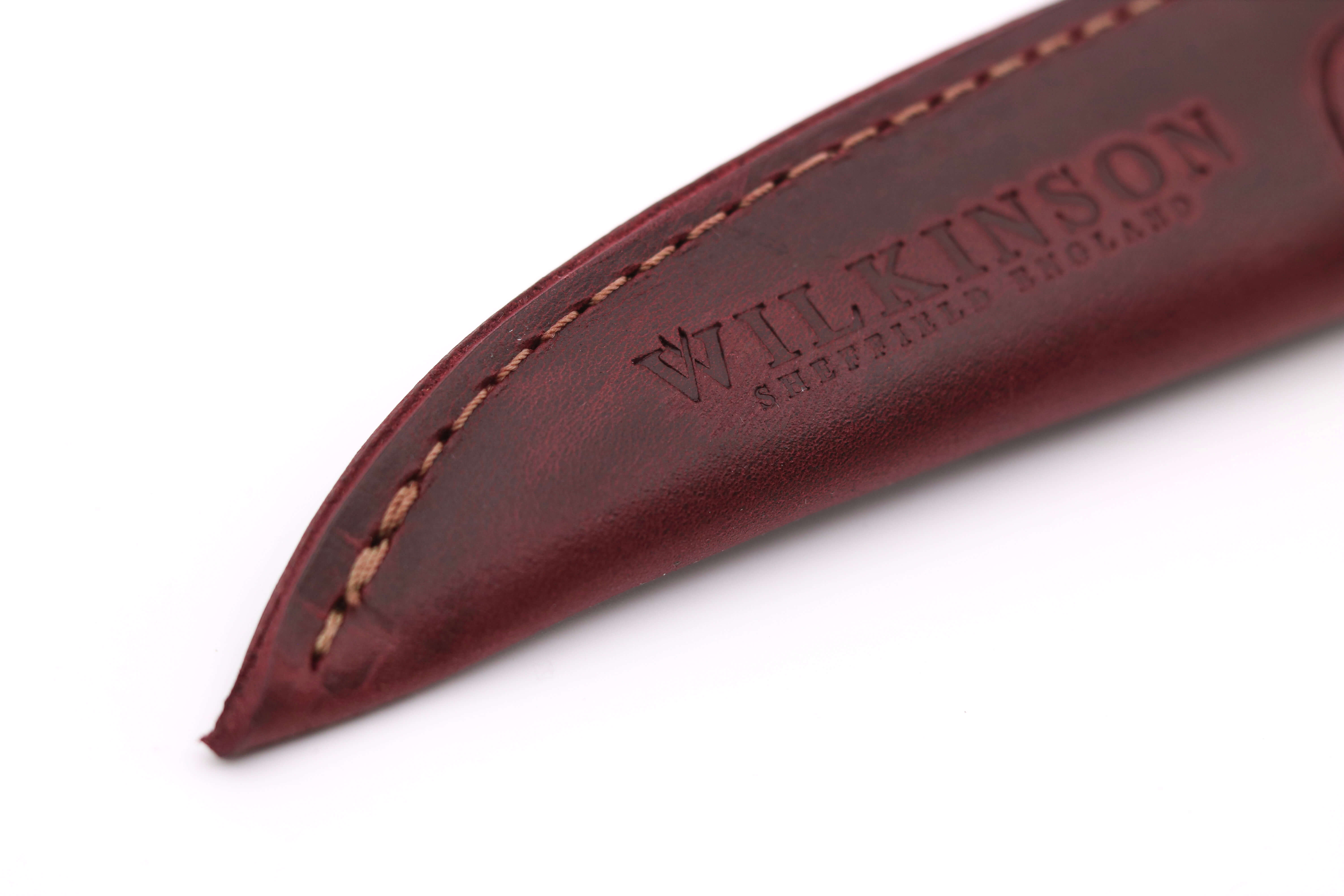 Close-up of vegetable-tanned oxblood leather on an 8-inch fabric shear sheath